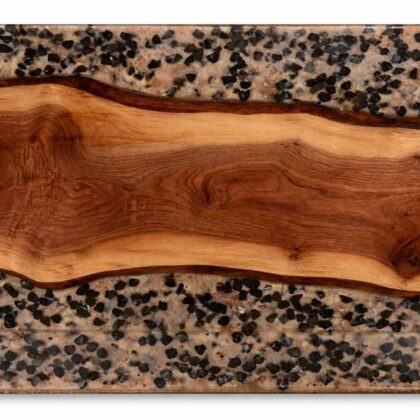 Rectangular panel featuring natural wood grain in center with speckled concrete containing black aggregates above and below